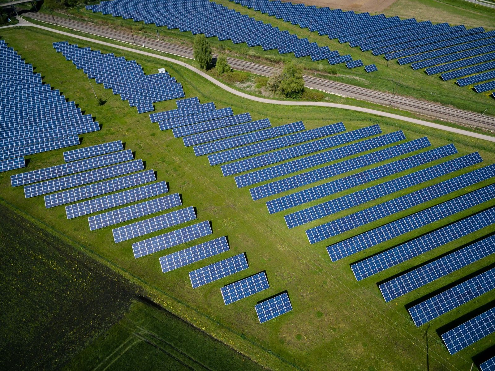 Restored landfill with a solar array or industrial units on the cap